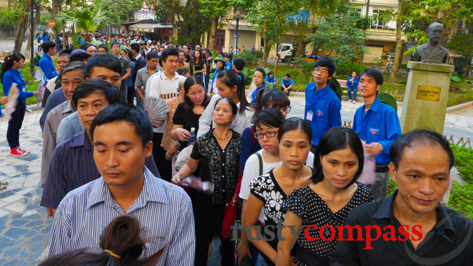 Crowds farewelling General Giap. The bust in the background is French / Swiss physician and scientist Alexandre Yersin.